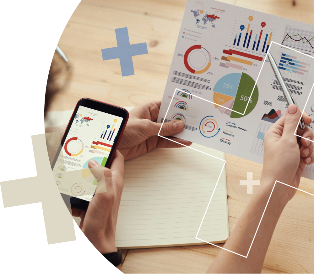 Hands reviewing business charts